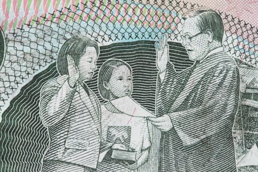 Close-up  of 200 peso with president Arroyo of The Philippines taking oath.