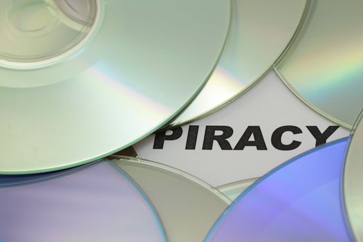 DVD, cd and word of piracy, concept.