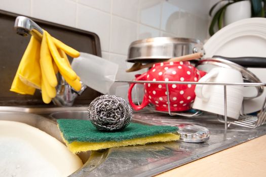 Scourer and scrubbing pads in a domestic kitchen