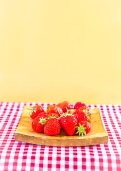 Fresh ripe strawberries on gingham