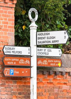 Nice set of road signs in Lavenham, England indicating local routes