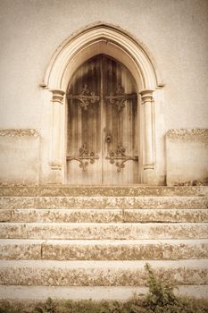 A lovely dreamy but spooky image of an old church door