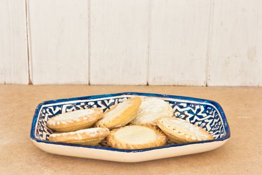 Gringe vintage style image of a plate of mince pies