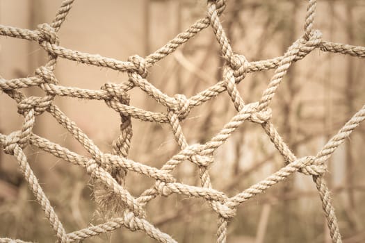 Conceptual sepia toned image of tangled rope