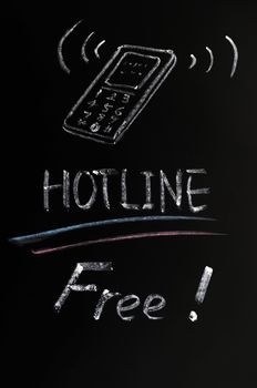 Free hotline concept drawn in chalk on a blackboard