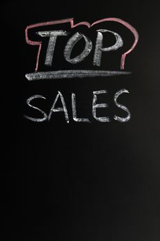 Top sales written in chalk on a blackboard