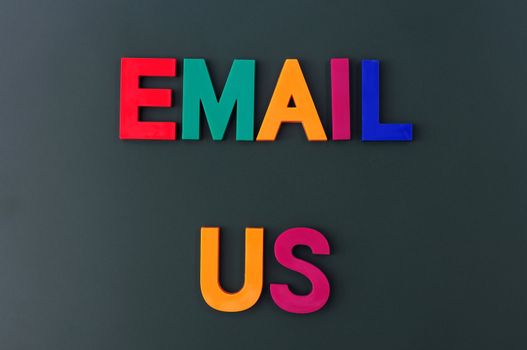 Email us made of colorful letters on a blackboard