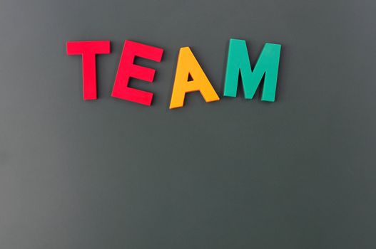 Team word made of colorful letters on a blackboard