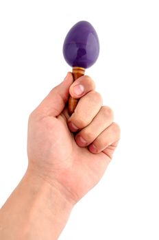 maraca in hand on a white background