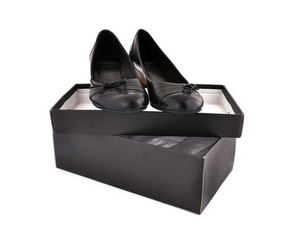 black ladies shoes and box  on a white background