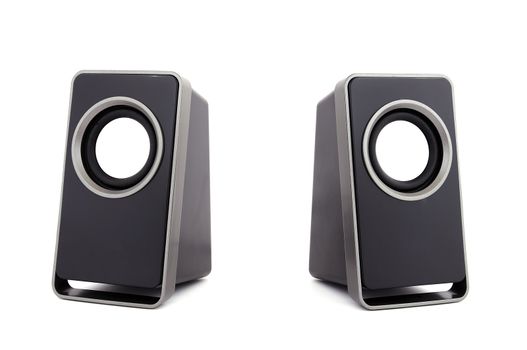 two computer speakers on a white background