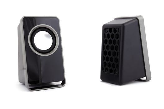 two computer speakers on a white background