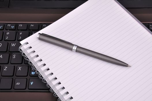 notebook, diary and pen on a white background