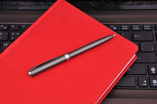 notebook, diary and pen on a white background