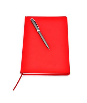 Red diary and pen on a white background