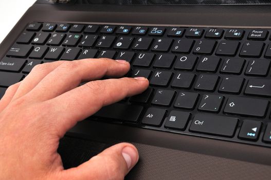 hand on a laptop on a white background