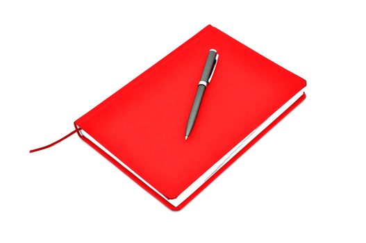 Red diary and pen on a white background