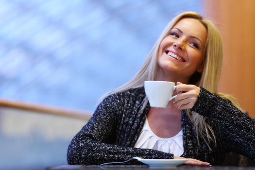  young woman drink coffee on modern background