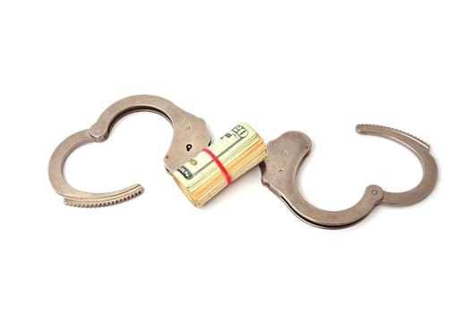 handcuffs and dollars on a white background