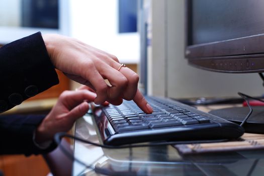 woman hands working on keyboard