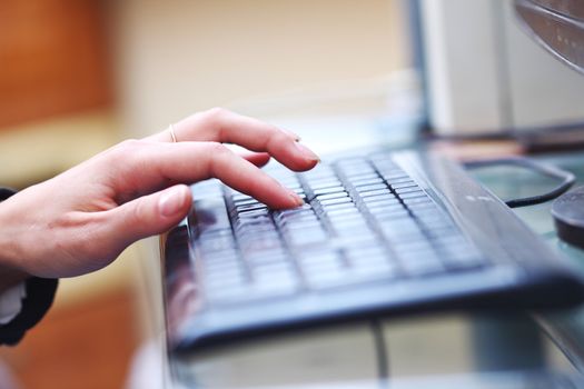 woman hands working on keyboard