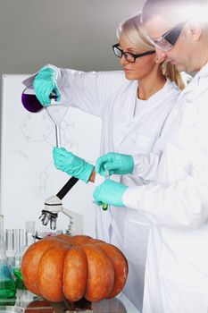 Scientist conducting genetic experiment with pumpkin