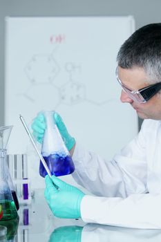 Chemistry Scientist conducting experiments in laboratory