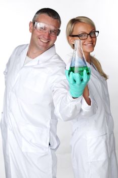  researchers holding a secret green chemical substance