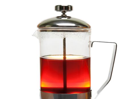 Afternoon drink - pouring heat tea cup from teapot