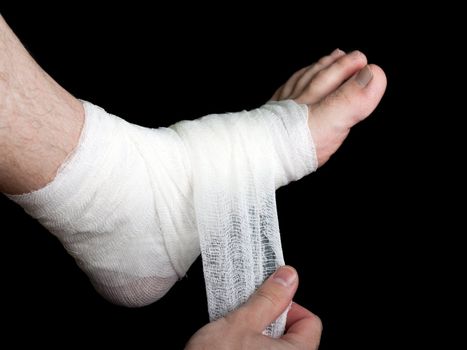 White medicine bandage on human injury foot