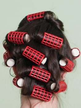 Curlers hair roller on adult beauty women