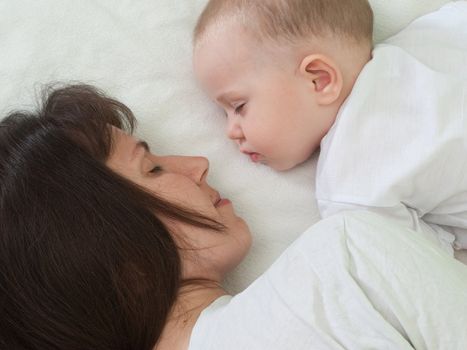 Sleeping mother and cute child in family love life