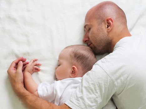 Sleeping father and cute child in family love life
