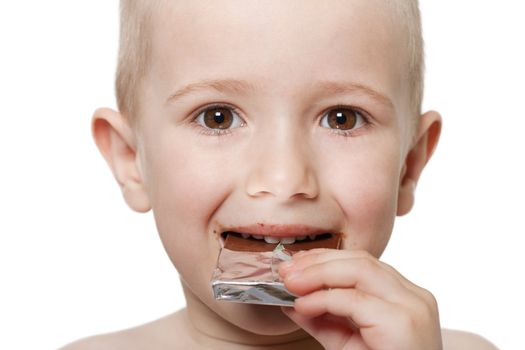 Little child holding sweet chocolate candy food