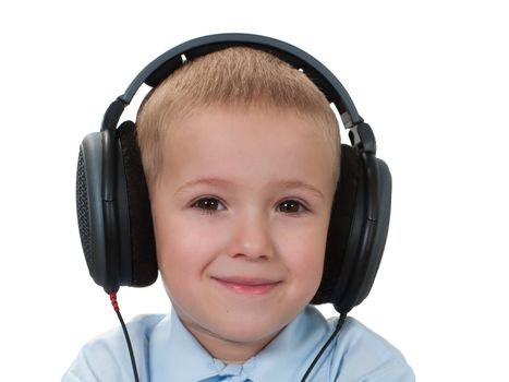 Little child in sound headphones listening music