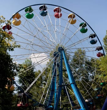 Ferris wheel on blue sky background