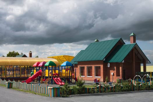 A colorful playground in a park .