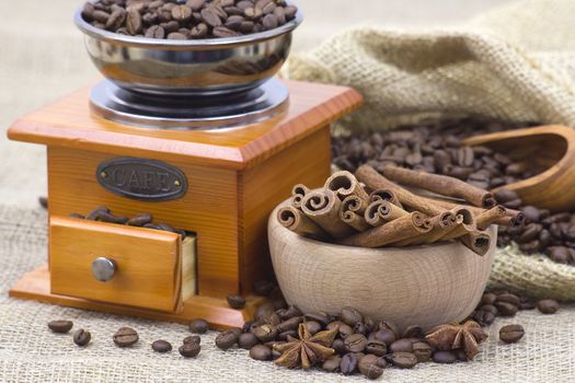 coffee beans, cinnamon and coffee grinder