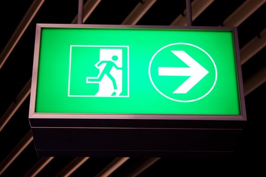 Emergency exit sign in modern offices inside an industrial plant