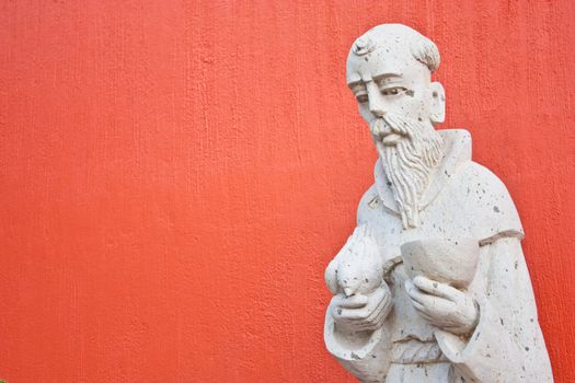 Saint Francis statue at the entrance of a Mexican church