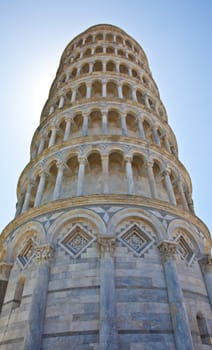 Italy - Pisa. The famous leaning tower on a perfect blue bakcground