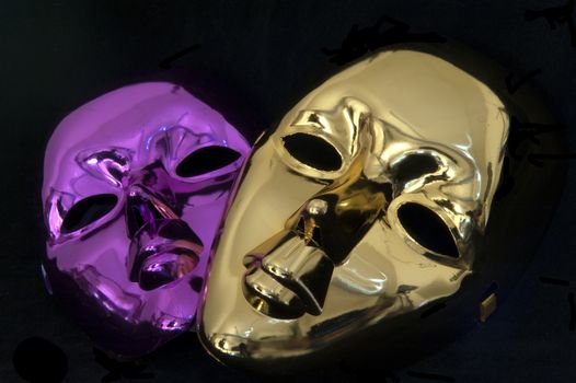 Carnival masks on black velvet background