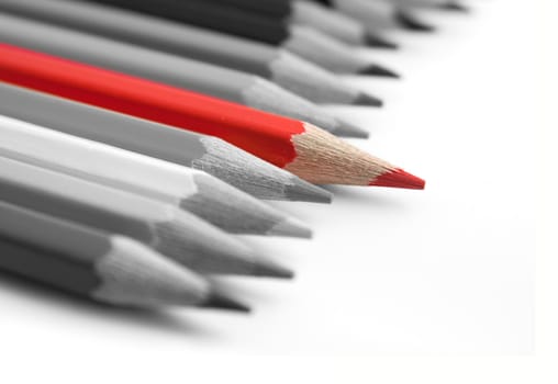 Red pencil among grey on white background