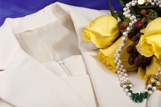 Wedding dress,necklace and yellow roses 