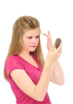 young blonde woman looks through mirror