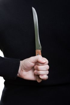 Murderer human hand holding kitchen knife weapon