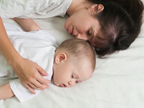 Sleeping mother and cute child in family love life