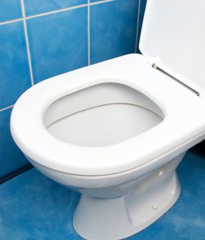 Home interior clean toilet sink bowl on tile floor