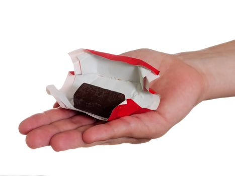 Human hand holding one sweet chocolate candy food