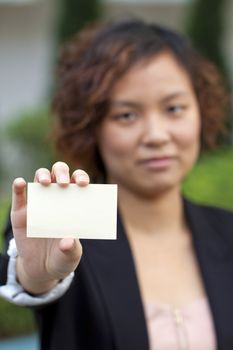 Business woman holding a name card